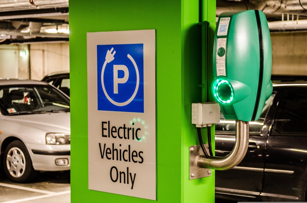 Electric Vehicle Only Sign on side of Charging Station